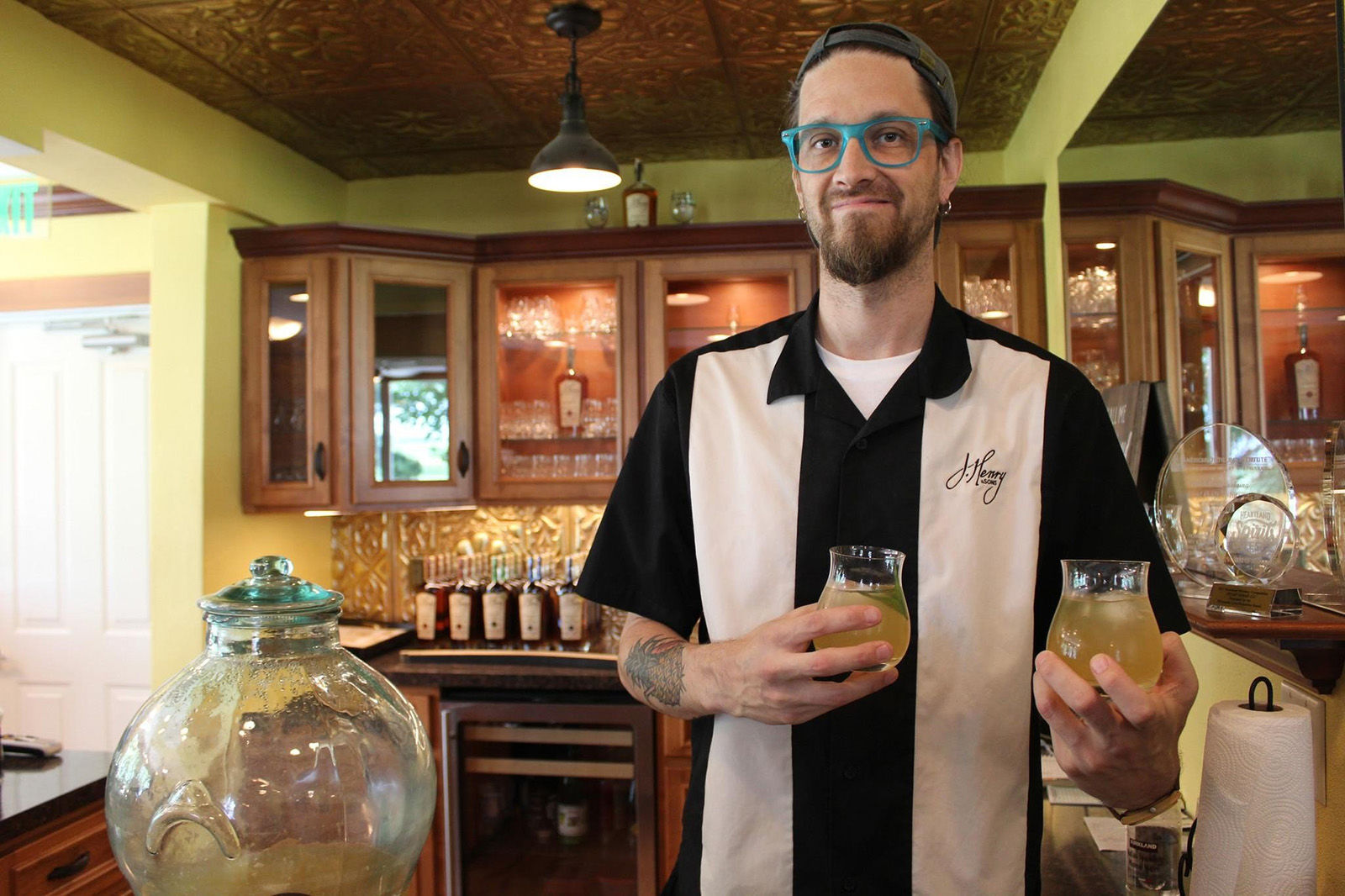 Aaron Rostad gets ready to pass out the Farmer’s Cocktail, the welcome drink of the day at J. Henry and Sons, near Madison, Wisconsin.